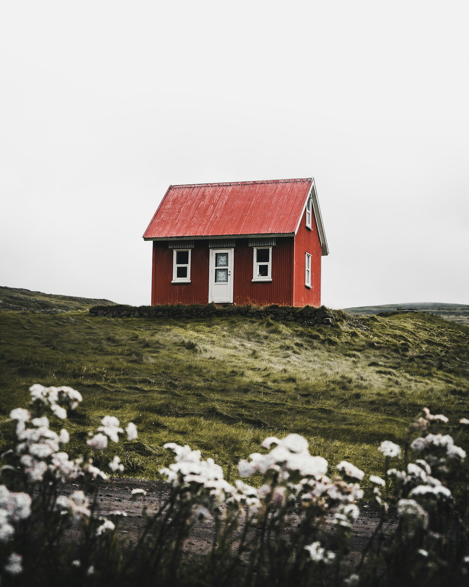 Illustrative stock photo of a brick house and roof edge, not a First Colony job