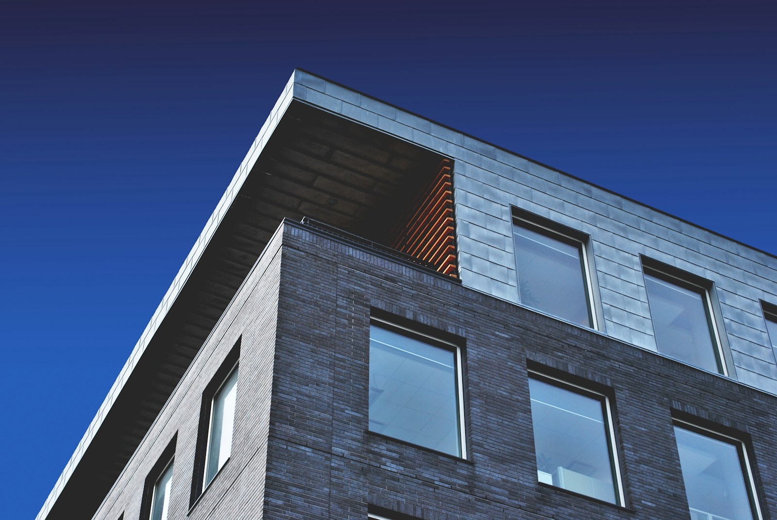 Illustrative stock photo of urban low-slope roofs, not a Montrose townhome