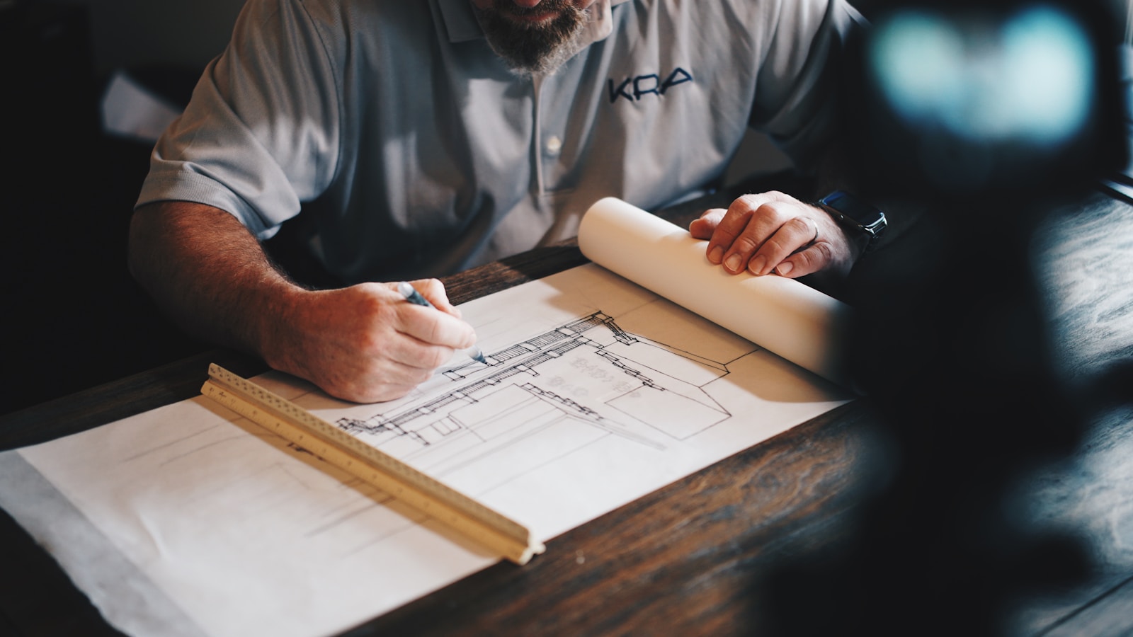 Illustrative stock photo of a roofer installing asphalt shingles, not a completed Houston project