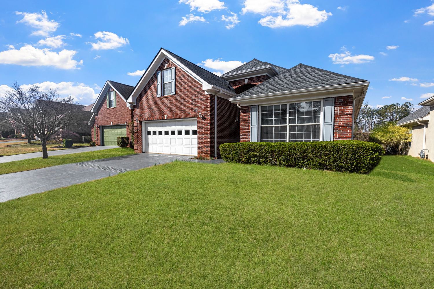 Illustrative stock photo of a house with an asphalt roof, not a specific Houston job